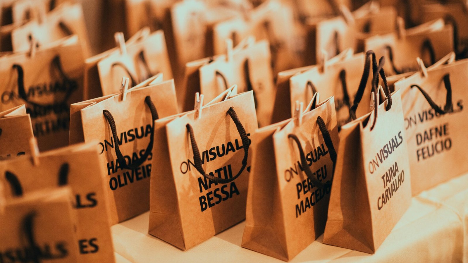 Close-up of eco-friendly paper bags with rope handles, ideal for events and packaging.